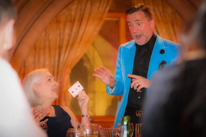 Martin Sanderson performing close-up magic at a gala dinner